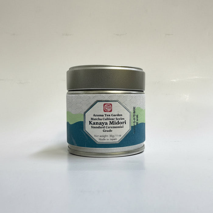 A tin container of Azuma Tea Garden's Kanaya Midori matcha, placed on a surface with natural lighting.