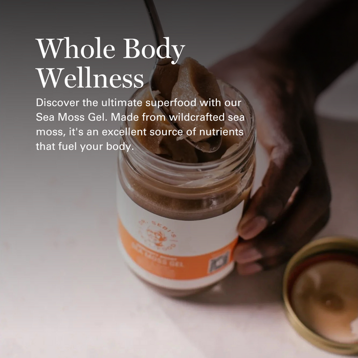 Hand holding open jar of Dr. Sebi's Sea Moss Gel with brown gel visible inside, wellness product display.