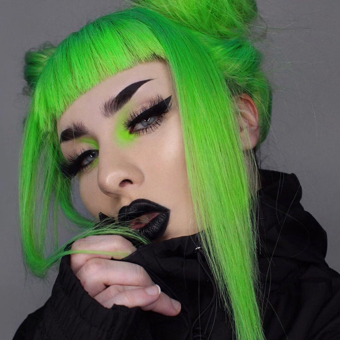 A woman with Electric Lizard hair color by MANIC PANIC