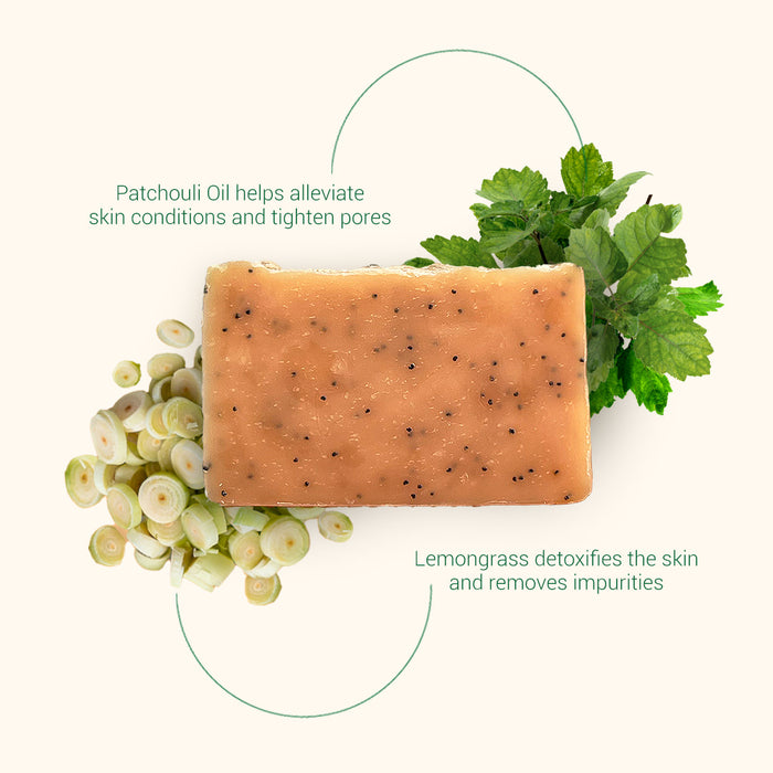 Top View of Herb'N Eden Lemongrass & Patchouli bar soap with patchouli leaves and lemongrass pieces highlighting natural skin benefits
